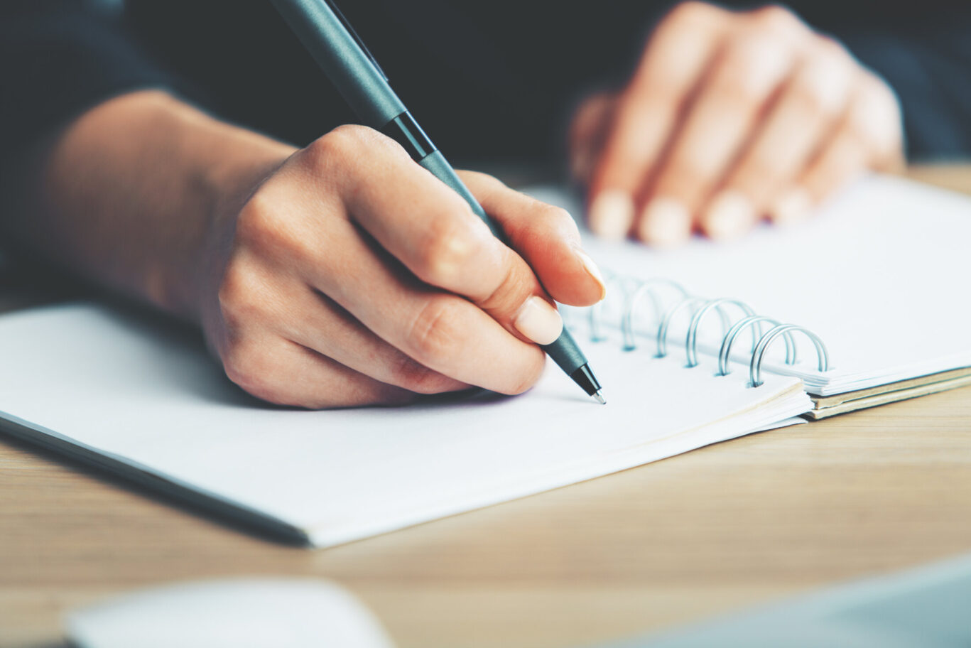 Woman writing in notebook