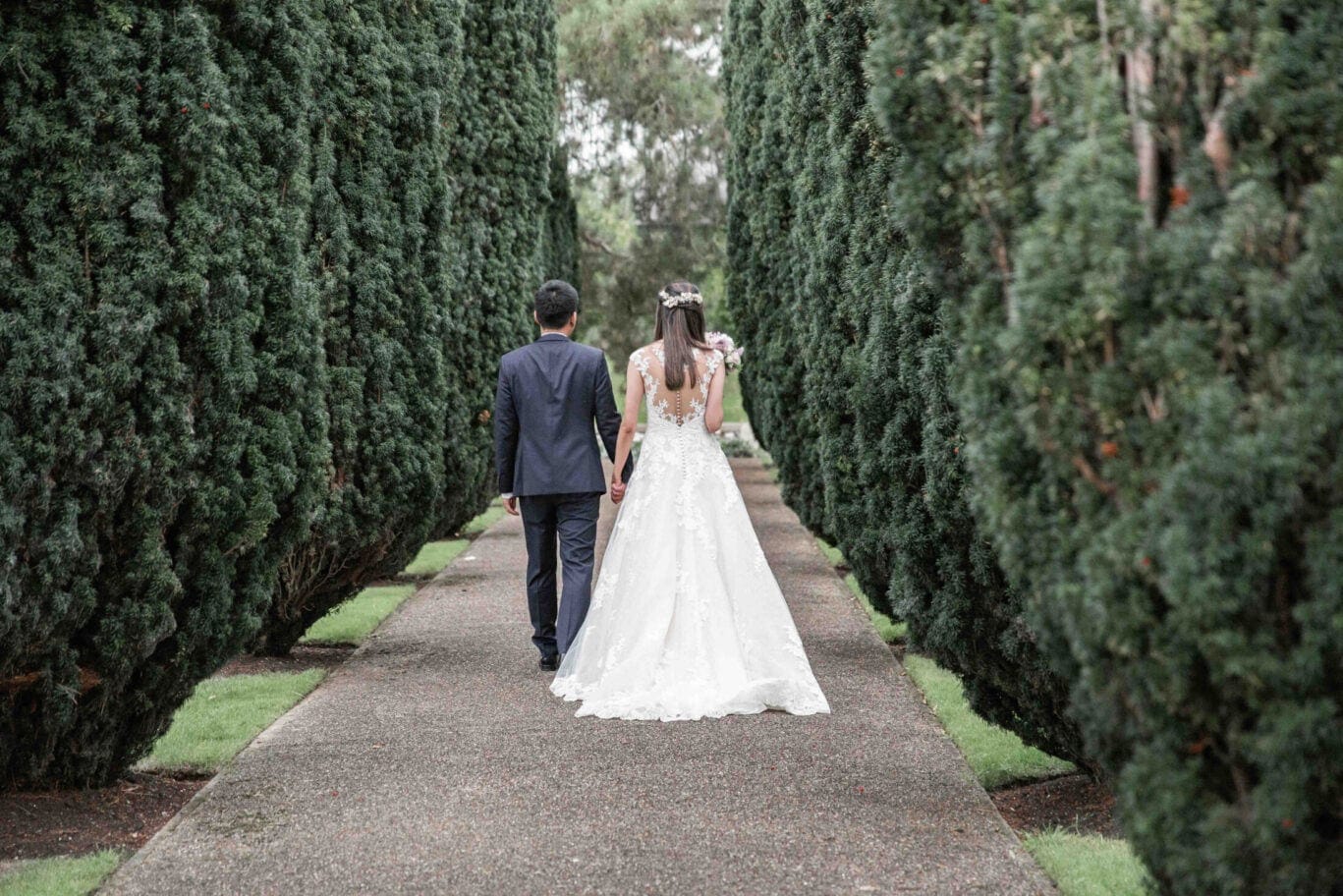 couple walking down the garden path