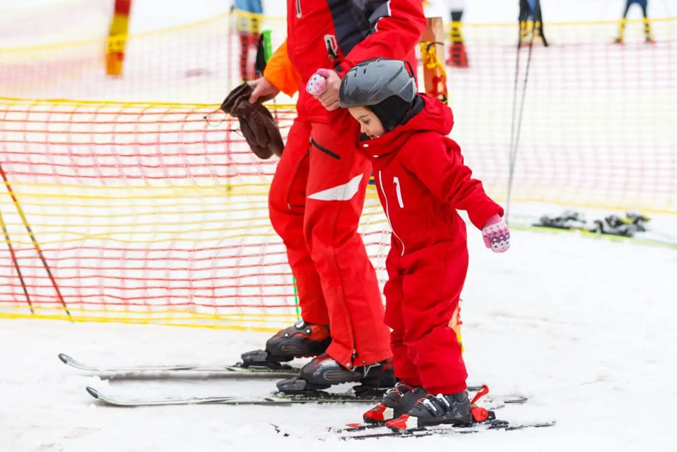 Little,Girl,In,Red,Learning,To,Ski,With,The,Help