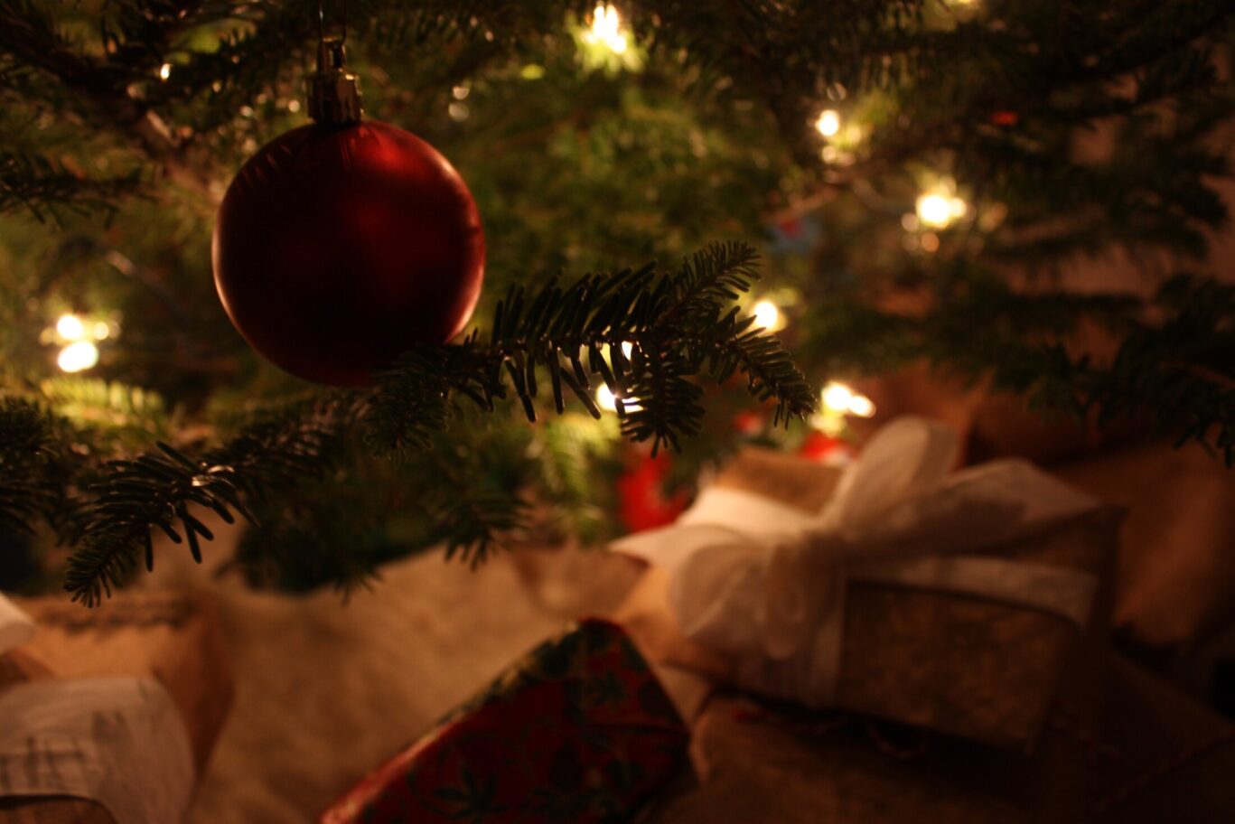 Christmas tree close-up with bauble and presents