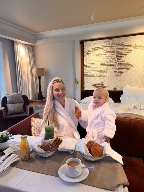 Mother and child enjoying in-room breakfast