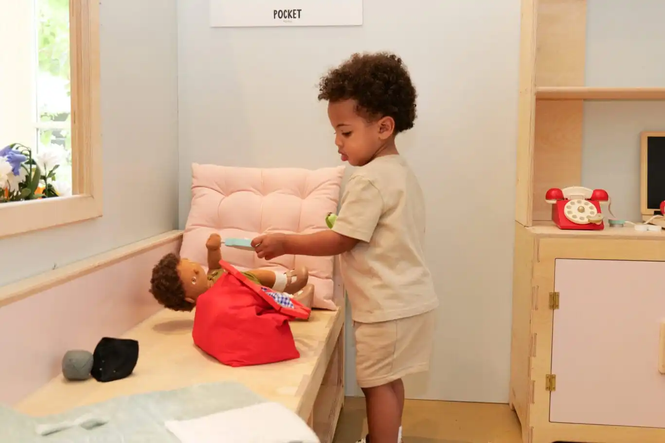 Child playing in doctor's surgery at Pocket Towns