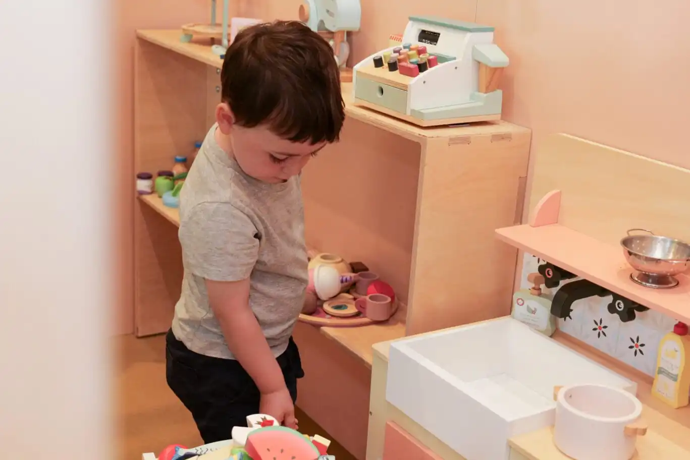 Child playing at Pocket Towns café